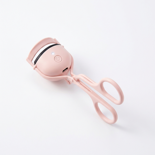 Eluppvärmd ögonfransböjare i rosa – produktbild